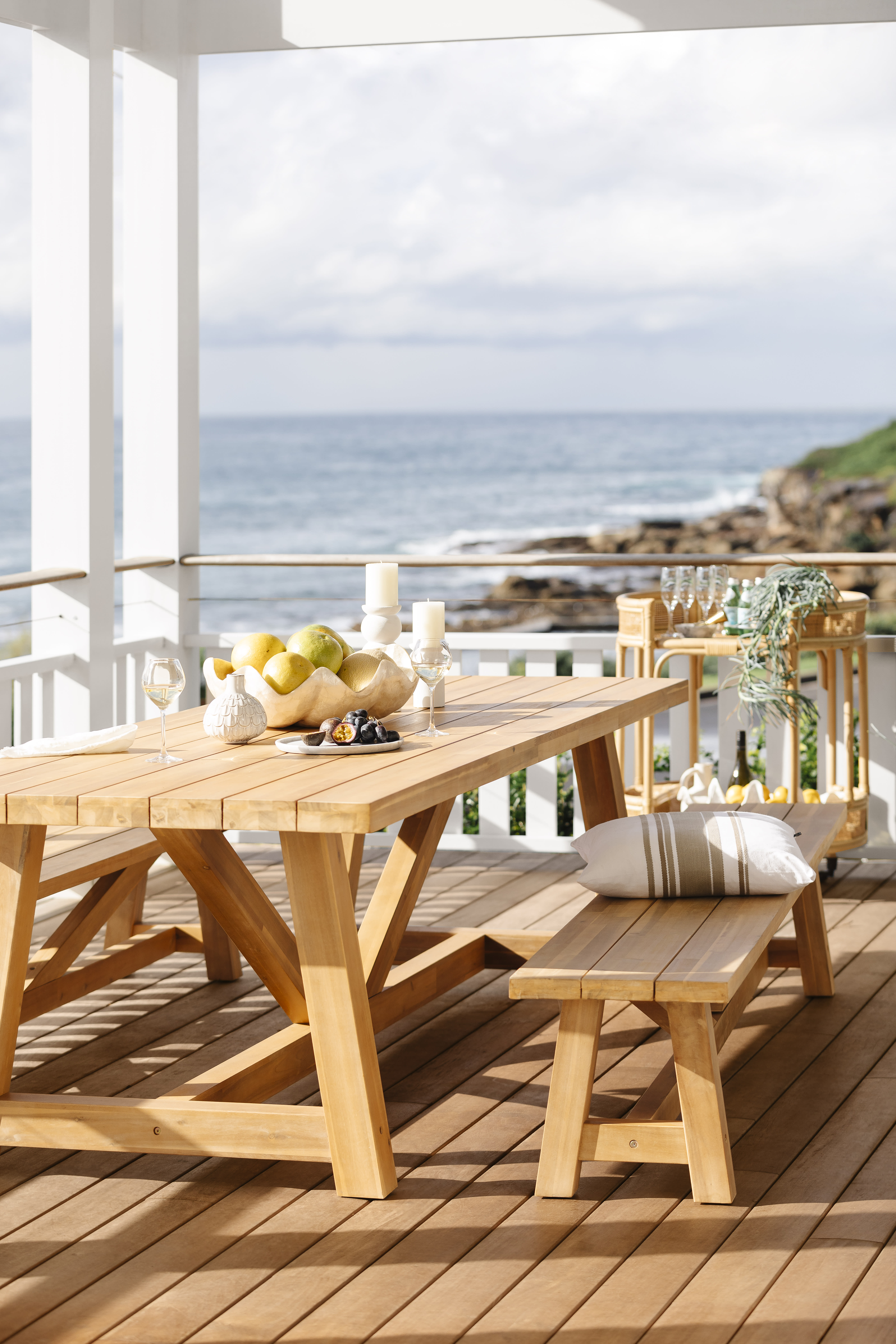 outdoor wooden furniture setting with a view